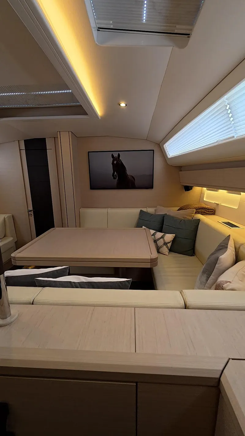 Slide: The Image of 2021 Jeanneau 54 sailboat deck with rigging and ocean view. - 22