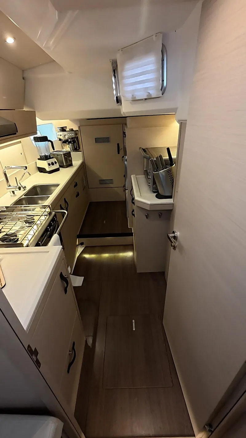 Slide: The Image of Luxurious interior of 2021 Jeanneau 54 yacht with modern furnishings and ambient lighting. - 23