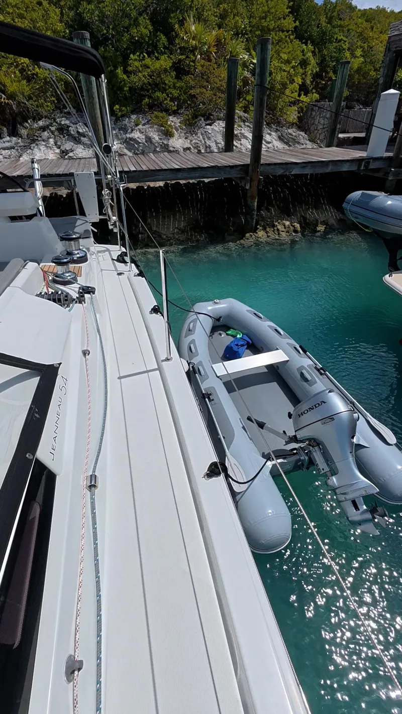 Slide: The Image of Staircase inside 2021 Jeanneau 54 yacht, leading to deck with open hatch. - 39