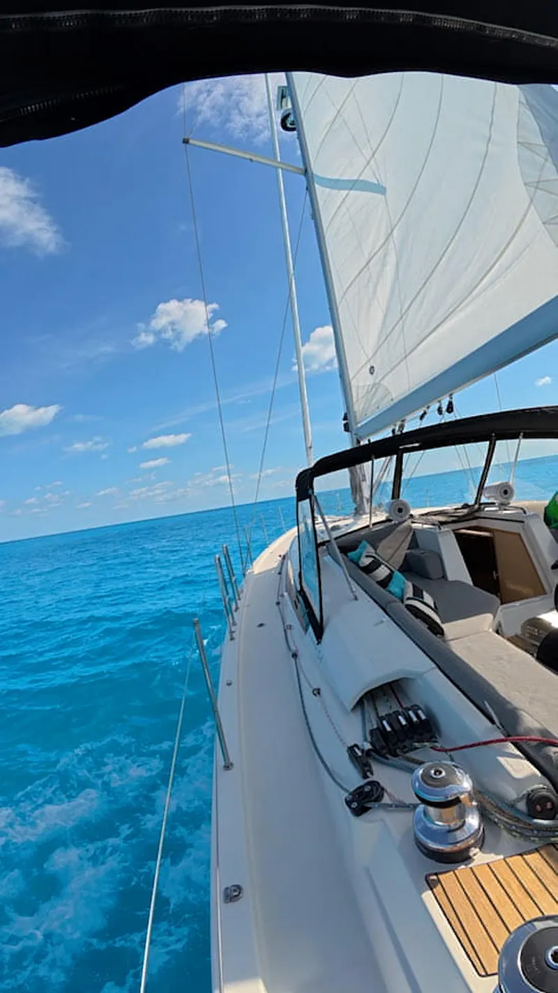 Slide: The Image of Modern kitchen in 2021 Jeanneau 54 yacht with stove, sink, and cutting board. - 46