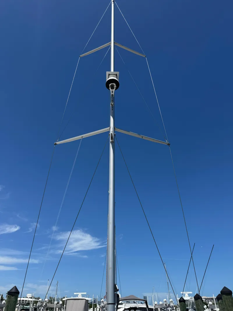 Slide: The Image of Jeanneau 54 sailboat at sunset, 2021 model, cruising on open sea. - 50