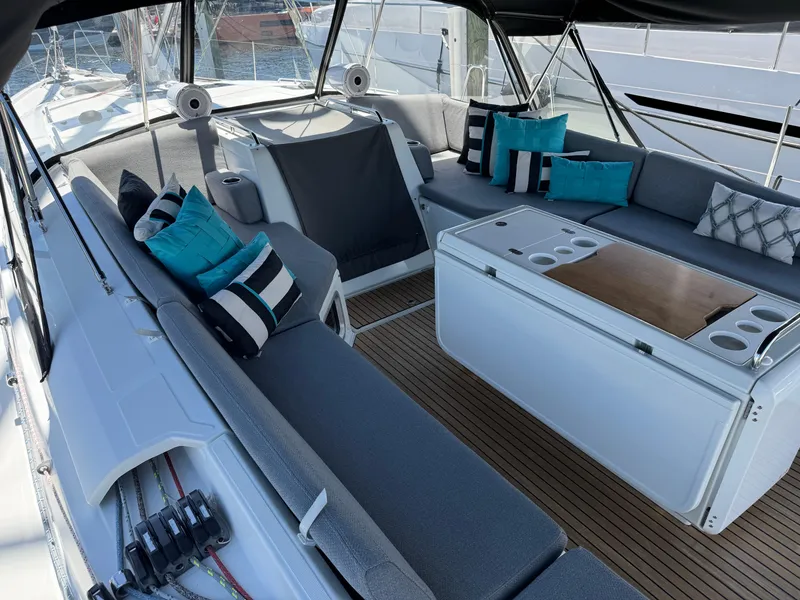 Slide: The Image of Jeanneau 54 sailboat, 2021 model, cruising in clear turquoise waters under a blue sky. - 51