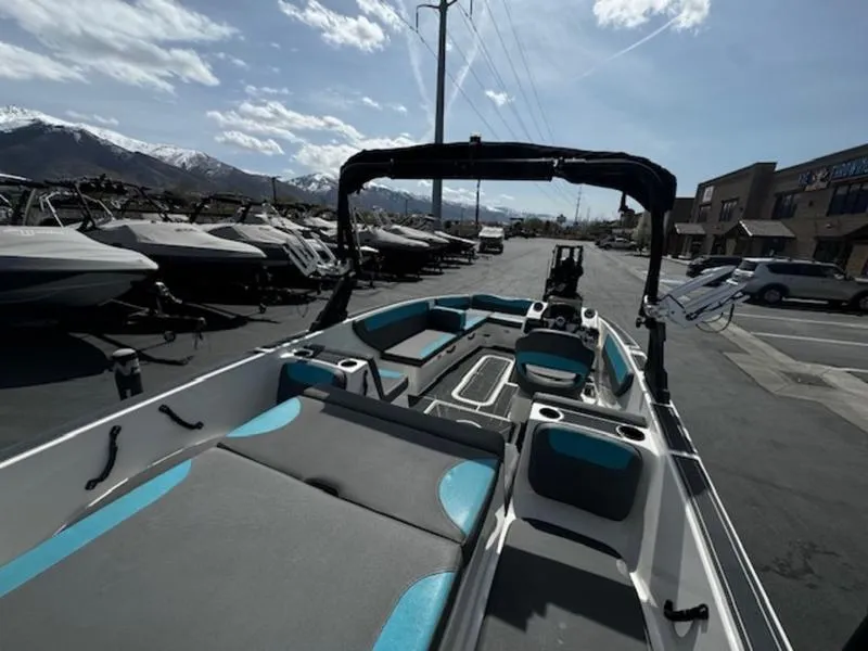 Slide: The Image of 2018 Heyday WT-2 boat with seating, parked outdoors under a clear sky. - 10