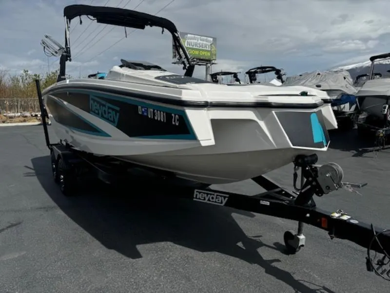 Slide: The Image of 2018 Heyday WT-2 boat on trailer, parked outdoors under cloudy sky. - 4