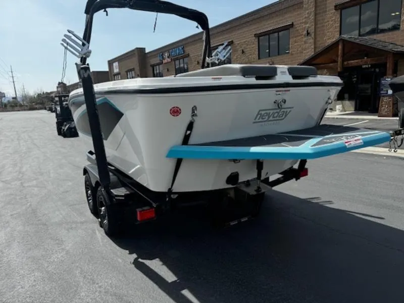 Slide: The Image of 2018 Heyday WT-2 boat on trailer, parked near buildings, rear view. - 7