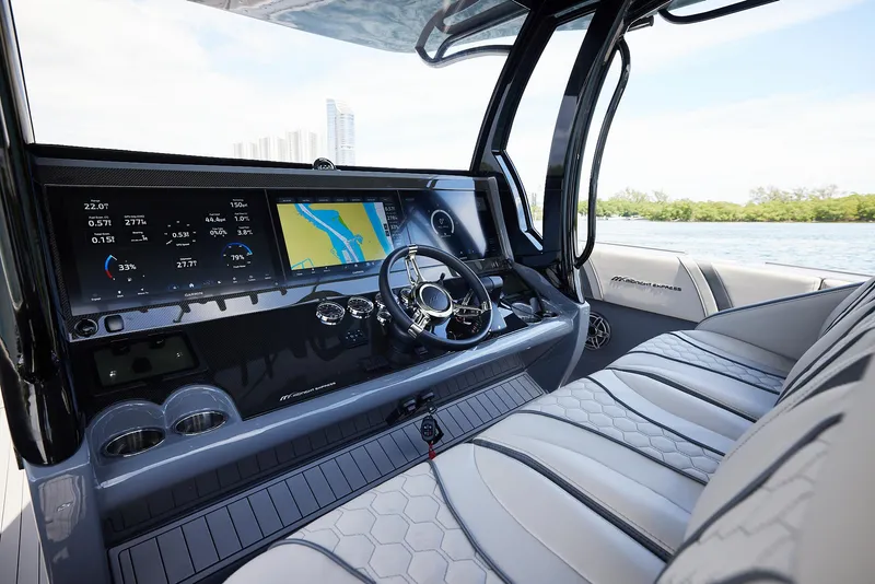Slide: The Image of 2025 Midnight Express 43' Open boat interior with advanced navigation system and luxurious seating. - 11