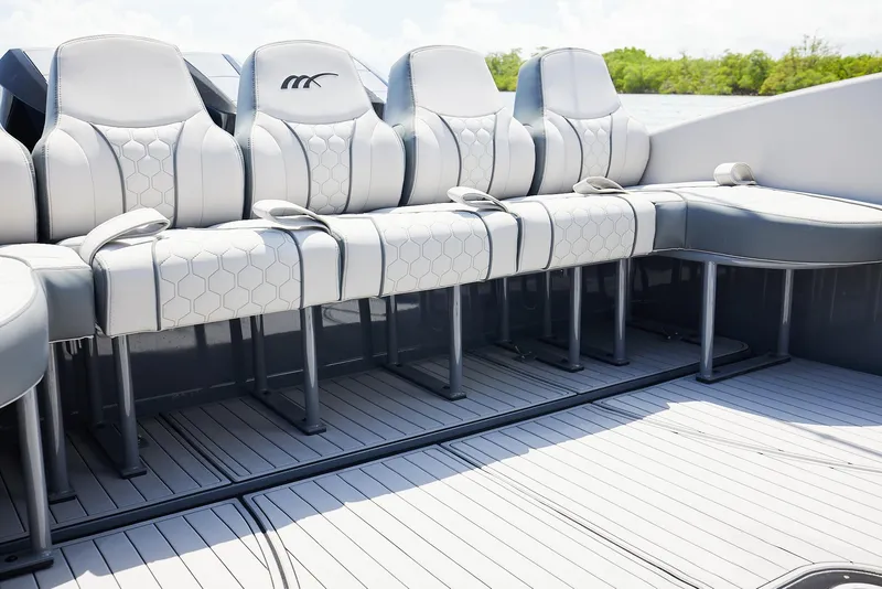 Slide: The Image of Luxury seating on 2025 Midnight Express 43' Open boat, featuring sleek design and comfort. - 17