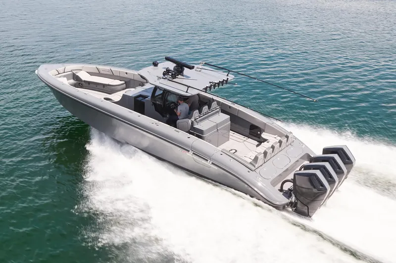 Slide: The Image of 2025 Midnight Express 43' Open boat cruising on water with triple outboard engines. - 3