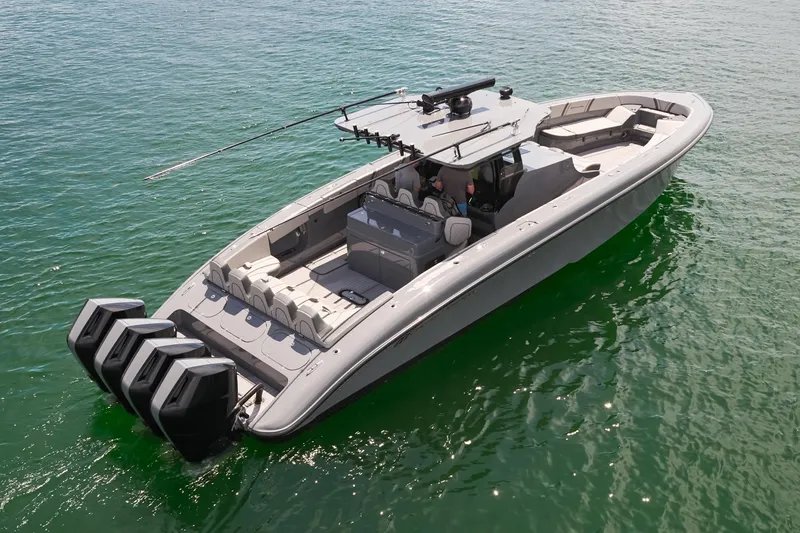 Slide: The Image of 2025 Midnight Express 43' Open boat on water, featuring sleek design and multiple outboard engines. - 4