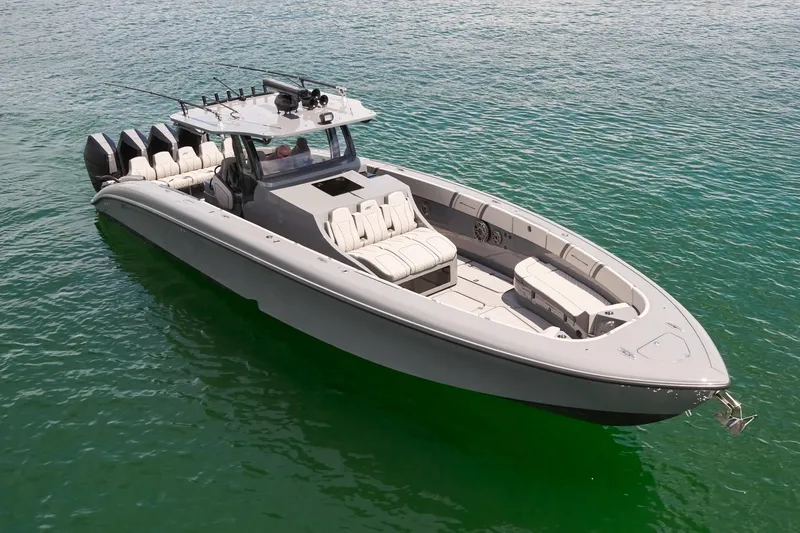 Slide: The Image of 2025 Midnight Express 43' Open boat on calm water, showcasing sleek design and spacious seating. - 5