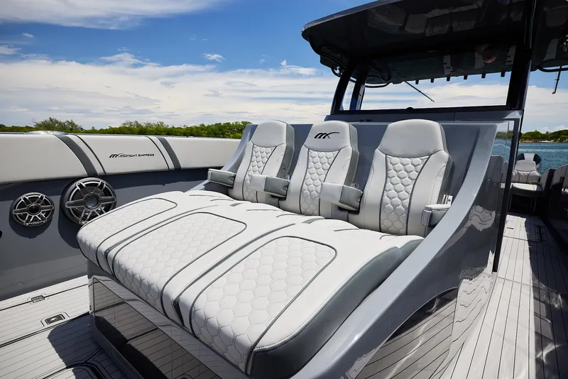 Slide: The Image of Luxurious seating on 2025 Midnight Express 43' Open boat, featuring sleek design and premium materials. - 8