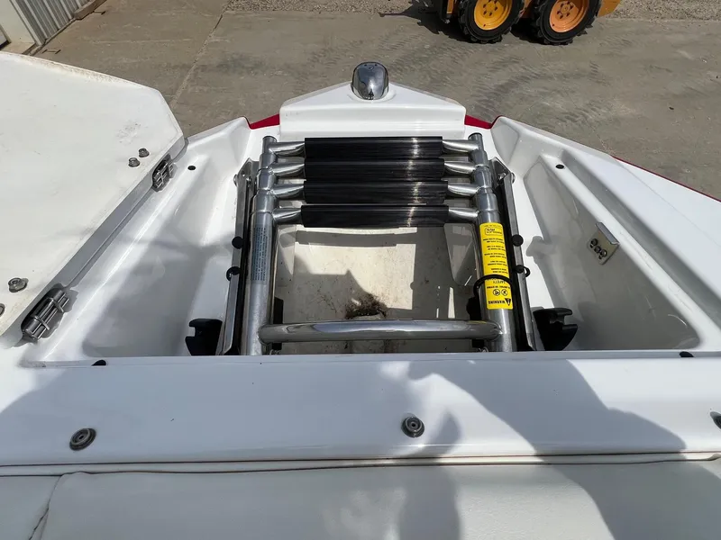 Slide: The Image of 2015 Monterey 218 Super Sport boat ladder and storage compartment. - 10