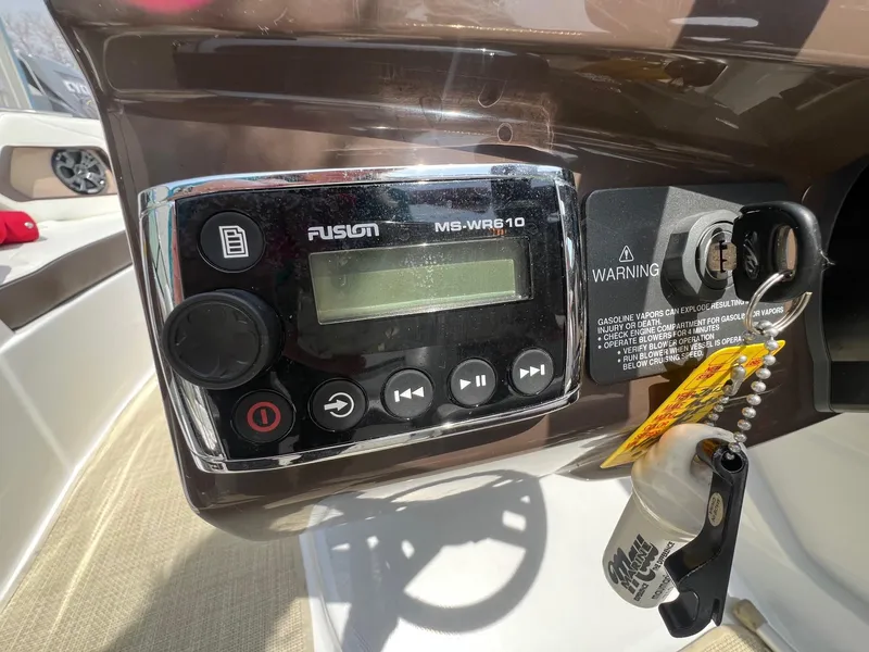 Slide: The Image of Control panel of a 2015 Monterey 218 Super Sport boat with Fusion MS-WR610 stereo. - 19