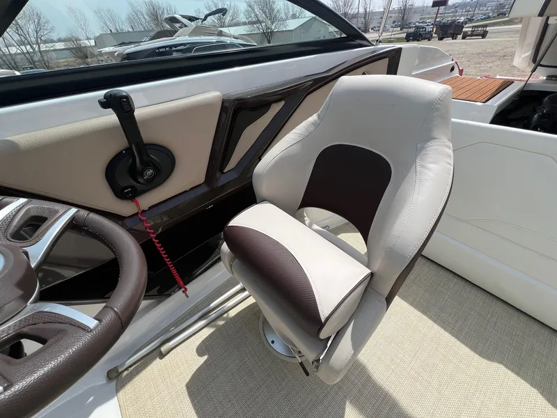 Slide: The Image of Captain's seat in a 2015 Monterey 218 Super Sport boat, featuring a sleek design. - 23