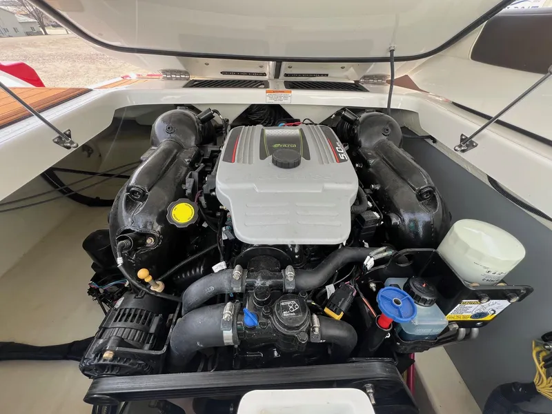 Slide: The Image of Engine compartment of a 2015 Monterey 218 Super Sport boat, showcasing detailed components. - 32