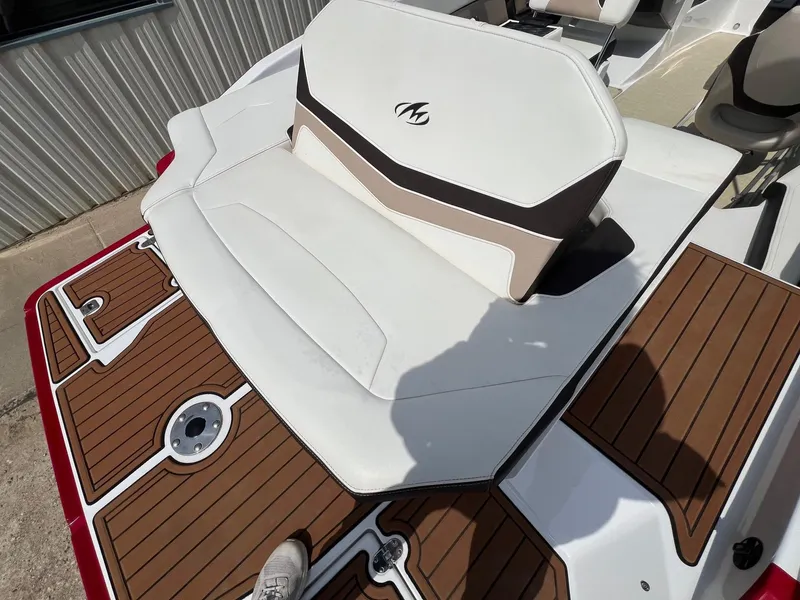 Slide: The Image of 2015 Monterey 218 Super Sport boat with white and brown seating and deck. - 34