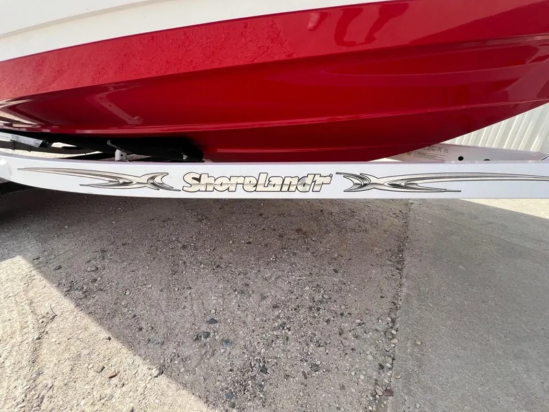Slide: The Image of Red 2015 Monterey 218 Super Sport boat on ShoreLand'r trailer, parked on concrete. - 38