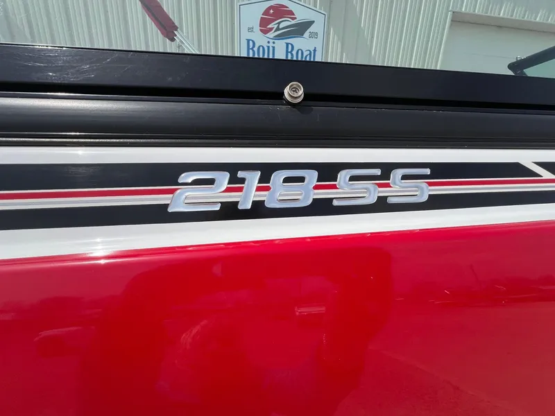 Slide: The Image of Red 2015 Monterey 218 Super Sport boat with "218 SS" emblem. - 5
