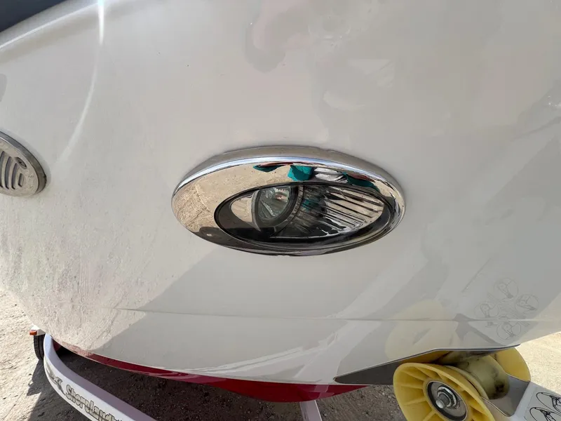 Slide: The Image of Close-up of a 2015 Monterey 218 Super Sport boat's chrome detail and trailer wheel. - 7