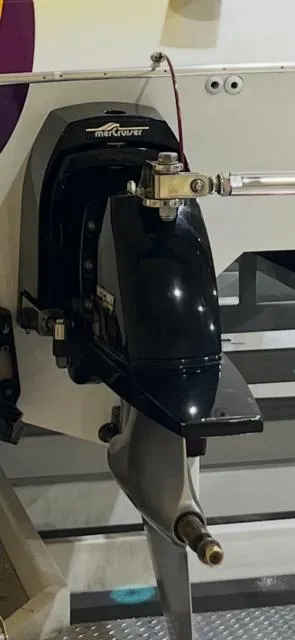 Slide: The Image of Close-up of a 1999 Skater 32B boat engine component with Mercury branding. - 6