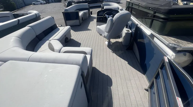 Slide: The Image of 2024 Bentley Pontoons Legacy 200 Cruise interior with spacious seating and modern helm. - 11