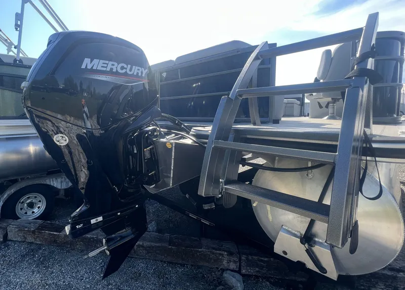 Slide: The Image of 2024 Bentley Pontoons Legacy 200 Cruise with Mercury outboard motor, rear view. - 3