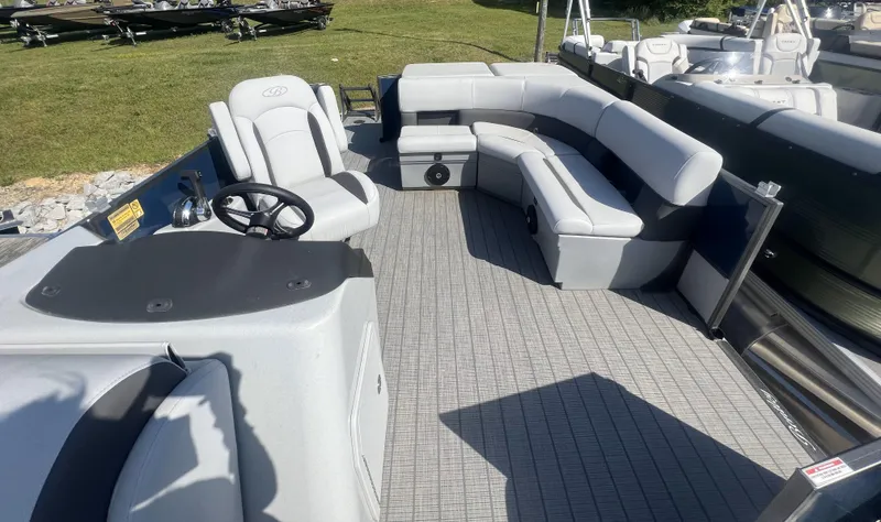 Slide: The Image of 2024 Bentley Pontoons Legacy 200 Cruise interior with plush seating and modern helm. - 7