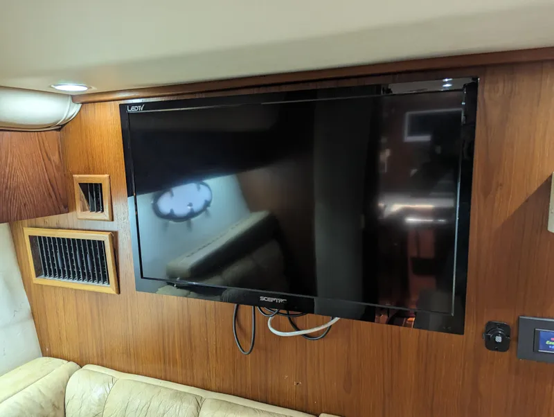 Slide: The Image of Flat-screen TV in 2000 Tiara Yachts 3500 Express cabin interior. - 12