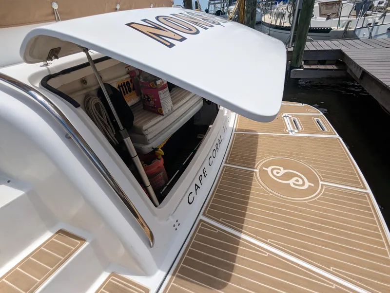 Slide: The Image of 2000 Tiara Yachts 3500 Express with open storage, docked in Cape Coral. - 29