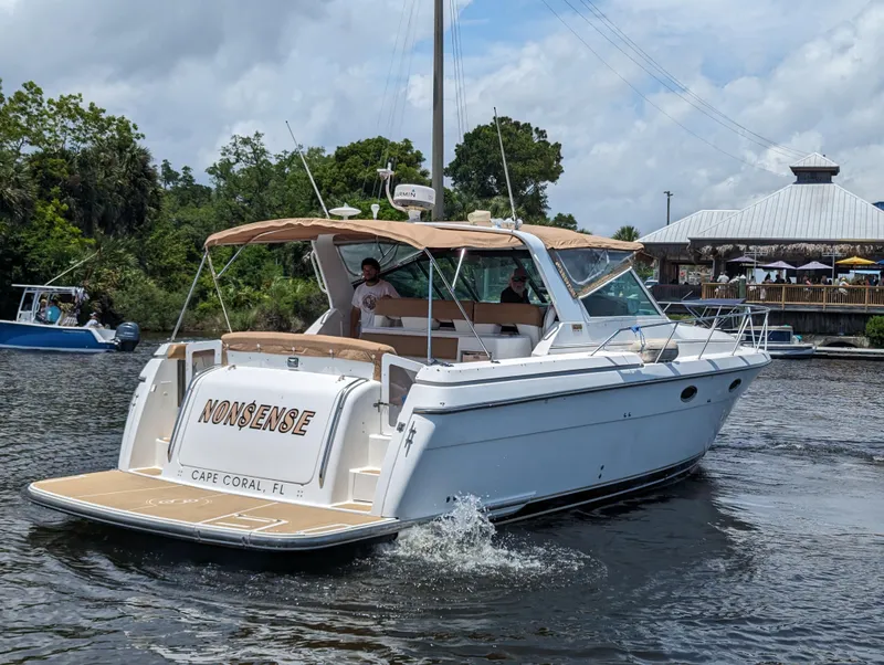 Slide: The Image of 2000 Tiara Yachts 3500 Express boat cruising on a river near Cape Coral, Florida. - 31