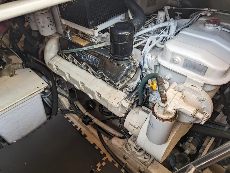 Slide: The Image of Engine compartment of a 2000 Tiara Yachts 3500 Express, showcasing detailed mechanical components. - 38