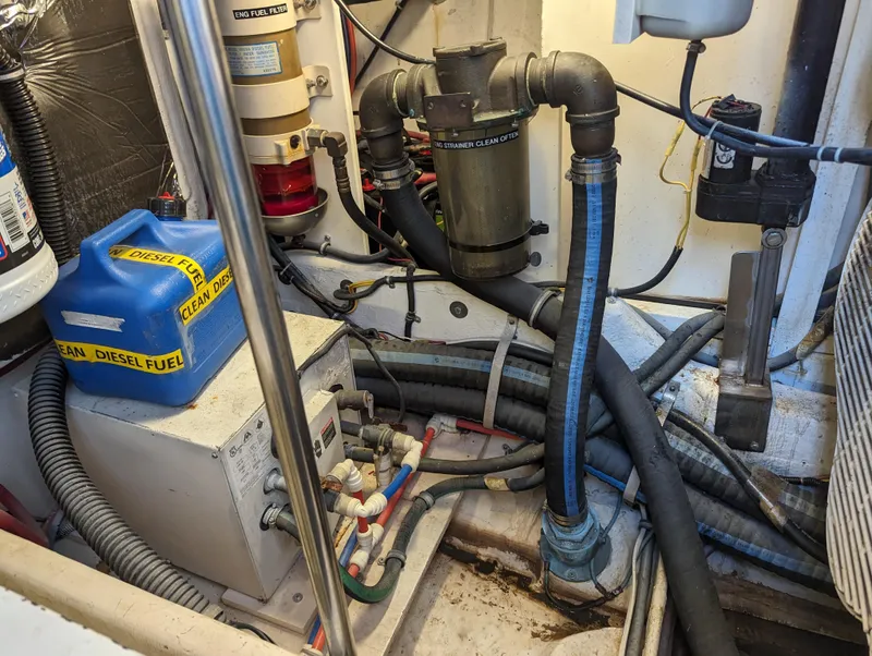 Slide: The Image of Engine room of 2000 Tiara Yachts 3500 Express with diesel fuel container and hoses. - 43