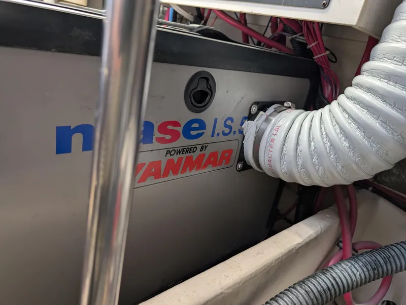 Slide: The Image of Engine compartment of a 2000 Tiara Yachts 3500 Express, featuring a Yanmar-powered generator. - 45