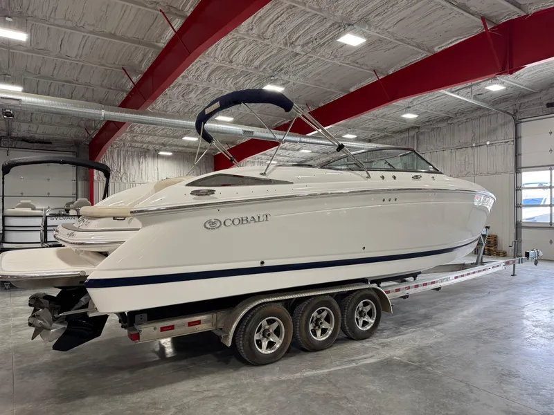 Slide: The Image of 2009 Cobalt 302 BR boat on trailer in indoor storage facility. - 3