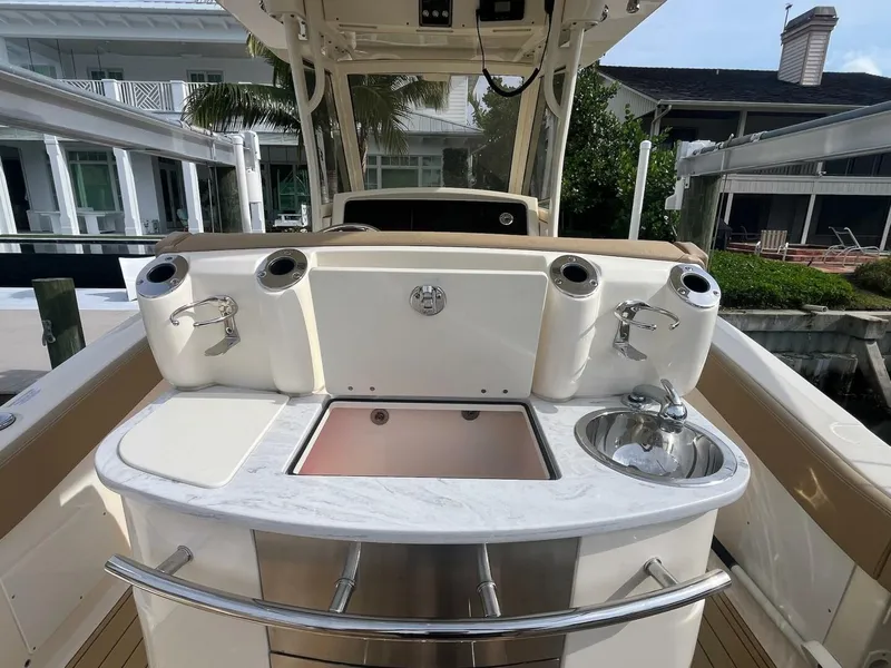 Slide: The Image of 2020 Scout 277LXF boat interior with sink and storage compartments. - 17