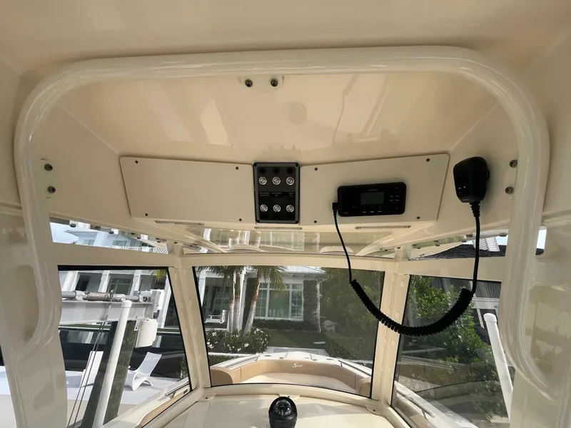Slide: The Image of 2020 Scout 277LXF boat interior with control panel and radio equipment. - 4