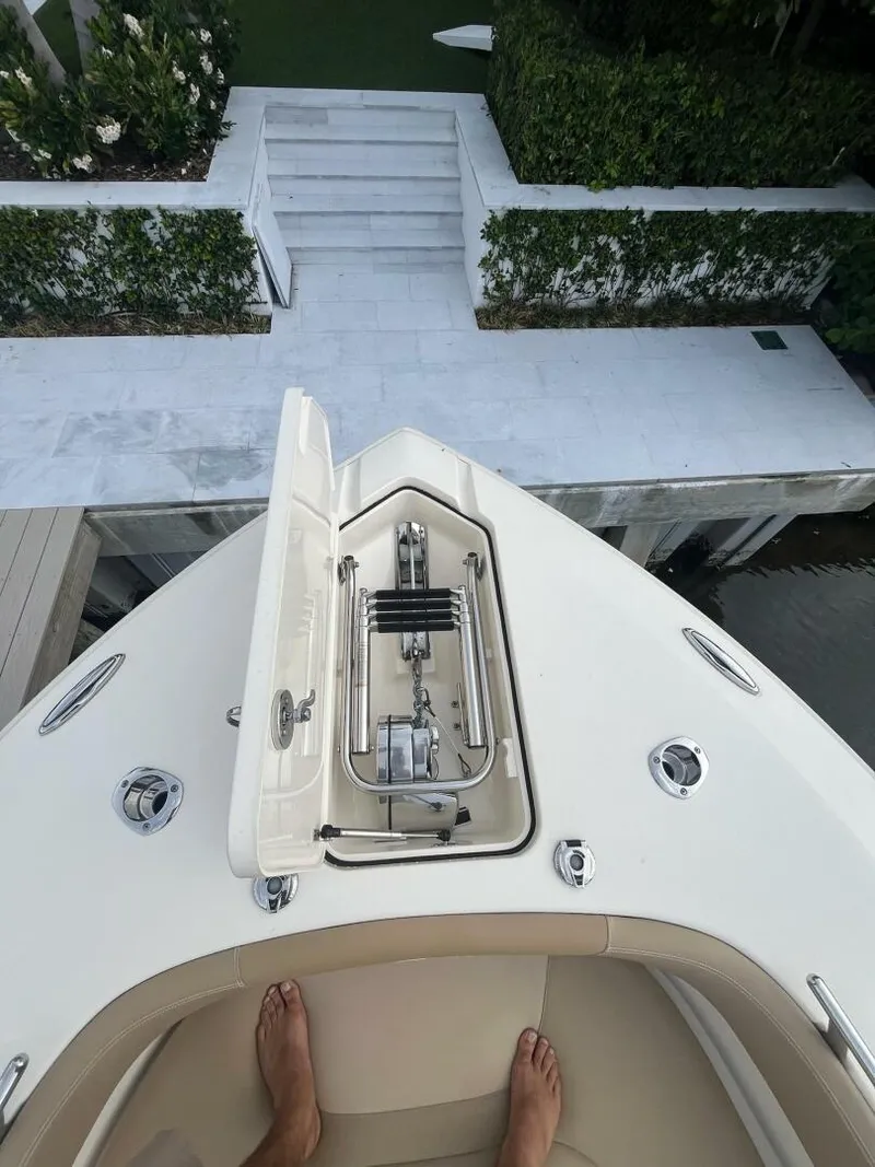 Slide: The Image of 2020 Scout 277LXF boat bow with anchor compartment, viewed from above. - 9