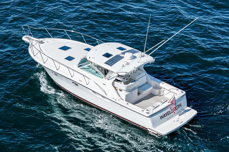 Slide: The Image of 2001 Tiara Yachts 3500 Open cruising on the ocean, aerial view. - 10