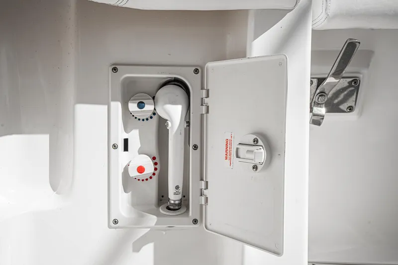 Slide: The Image of 2001 Tiara Yachts 3500 Open shower controls with hot and cold settings. - 21