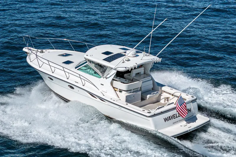 Slide: The Image of 2001 Tiara Yachts 3500 Open cruising on ocean, displaying American flag. - 3