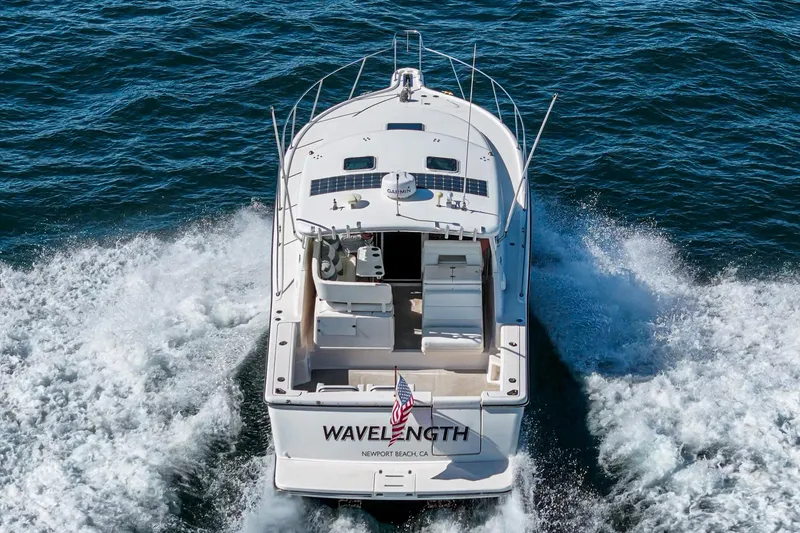 Slide: The Image of 2001 Tiara Yachts 3500 Open cruising on the ocean, rear view. - 4