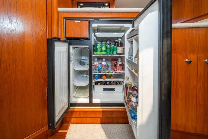 Slide: The Image of Refrigerator stocked with drinks inside 2001 Tiara Yachts 3500 Open cabin. - 40