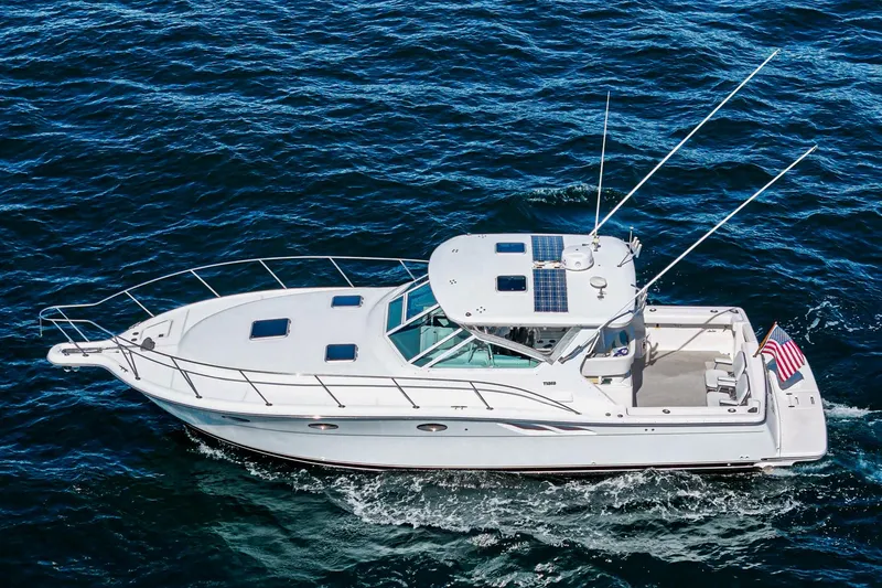 Slide: The Image of 2001 Tiara Yachts 3500 Open cruising on blue ocean waters. - 9