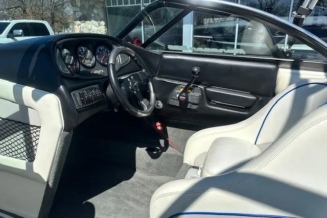 Slide: The Image of 2003 Malibu Wakesetter VLX interior with steering wheel, dashboard, and seating. - 14