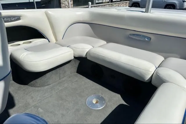 Slide: The Image of 2003 Malibu Wakesetter VLX interior with white leather seating and carpeted flooring. - 15