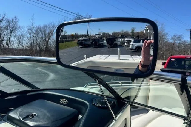 Slide: The Image of 2003 Malibu Wakesetter VLX boat interior with rearview mirror reflecting parked vehicles. - 17