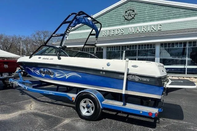 Slide: The Image of 2003 Malibu Wakesetter VLX boat on trailer at Reed's Marine dealership. - 2