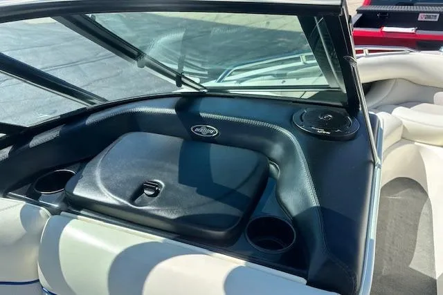 Slide: The Image of 2003 Malibu Wakesetter VLX boat interior with dashboard and cup holders. - 22