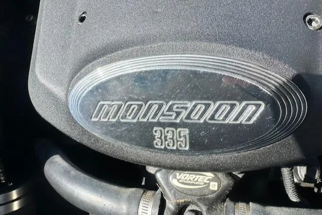 Slide: The Image of 2003 Malibu Wakesetter VLX engine with Monsoon 335 Vortec label. - 26