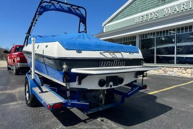 Slide: The Image of 2003 Malibu Wakesetter VLX boat on trailer outside Reed's Marine. - 30